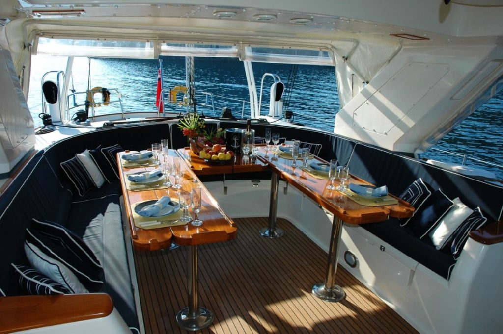 Brown Dining Table Near Couch in a yacht
